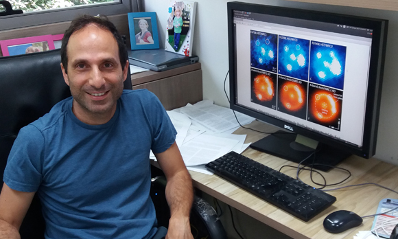 שיטה חדשה לחשב את קצב ההתפשטות של היקום. ד"ר ערן אופק עם תמונות הסופרנובה | צילום: איתי נבו