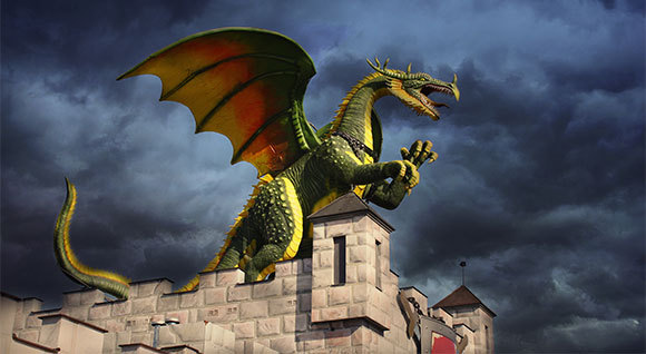 ציור של דרקון ירוק בראש טירה | Shutterstock, KENAN MUTLU