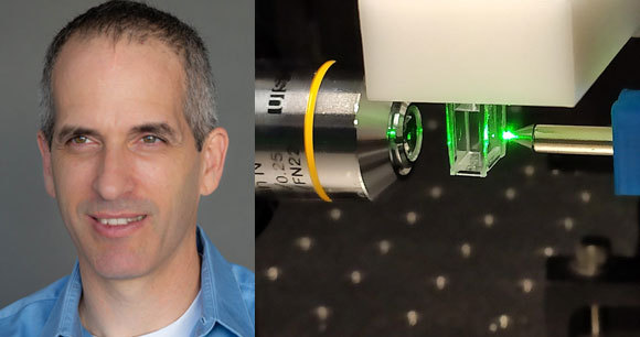 עמוס דניאלי והלייזר המודד ריכוז חומרים בדגימה | צילומים: שמואל בורג, לילך ברעם