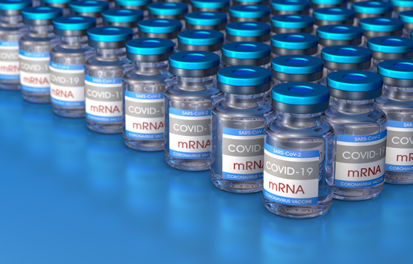 Rows of vials of messenger RNA vaccines against COVID-19 | Shutterstock, CROCOTHERY