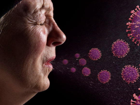 שיעול והתעטשות עלולים להפיץ את הנגיפים. אילוסטרציה של נגיפי קורונה משתחררים בהתעטשות | Tim Vernon, SPL